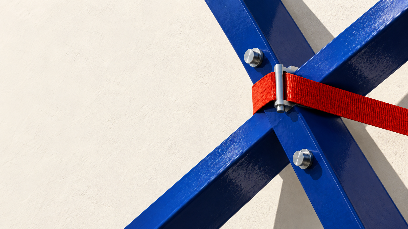 Ultramarine structural braces joined by a red tension strap